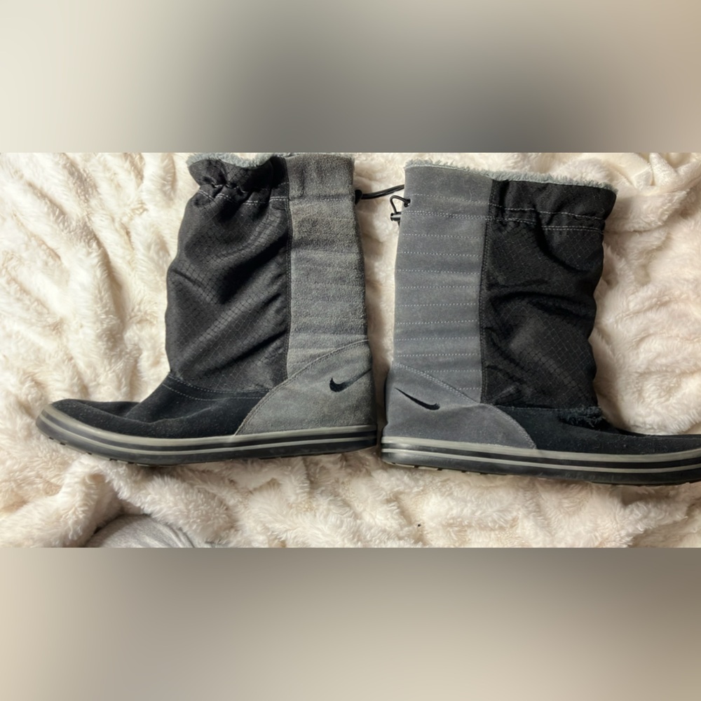 Nike boots !  Small tear on the top